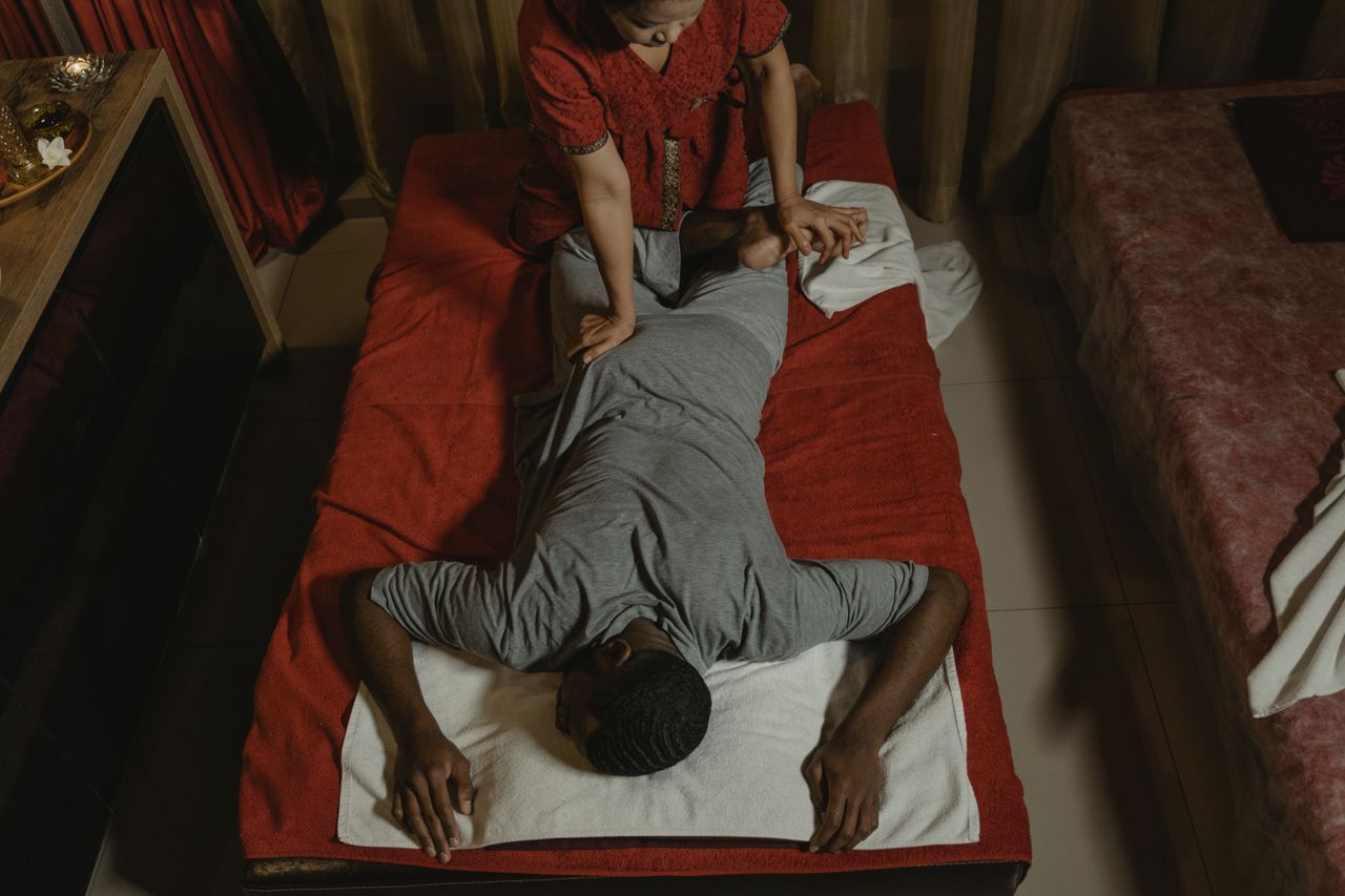 Relaxing Thai massage in a serene spa setting, enhancing wellness and relaxation.
